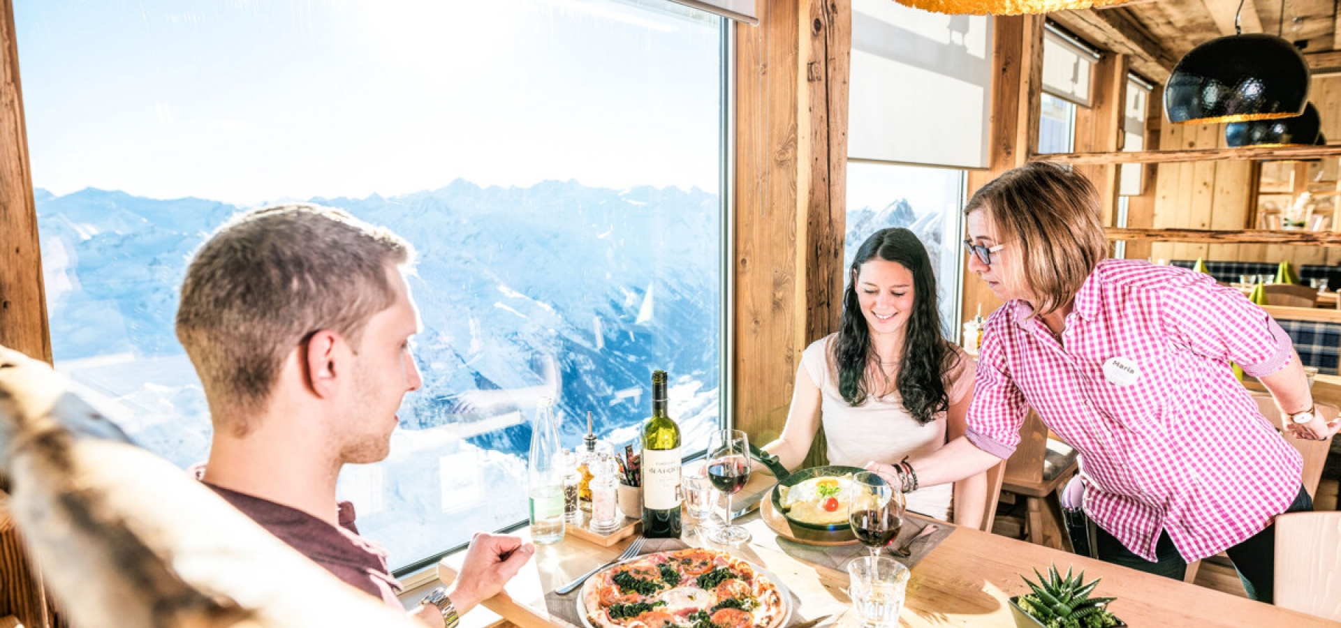 Mount Titlis Panoramic Restaurant A couple are served a meal in a panoramic restaurant