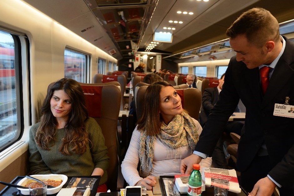 Customers eating their meals on the train.