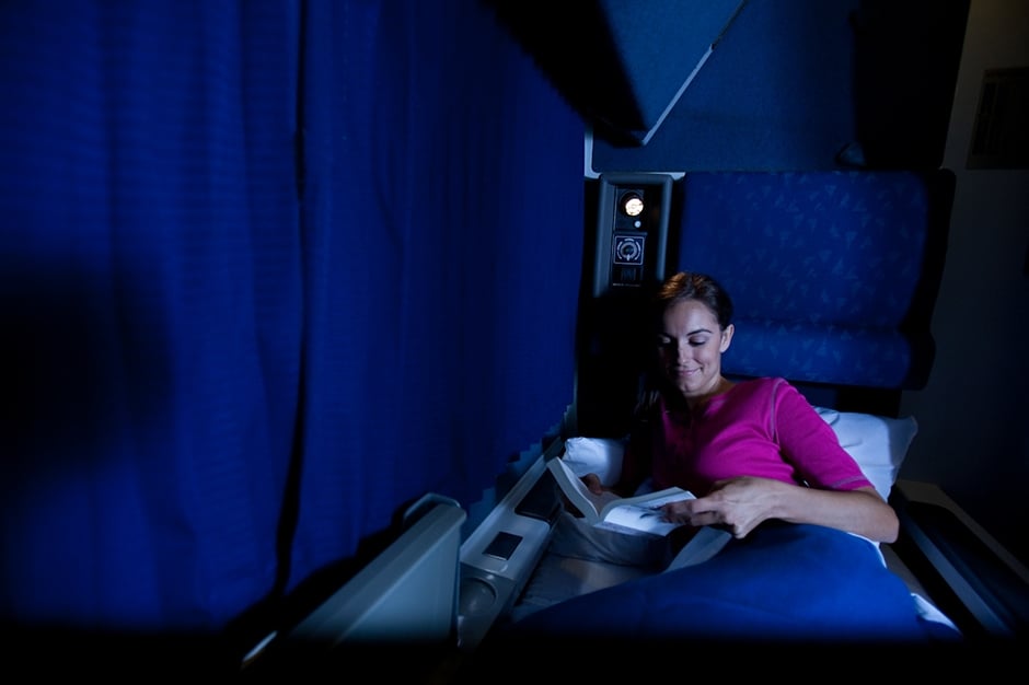 Woman enjoying her onboard overnight train journey.